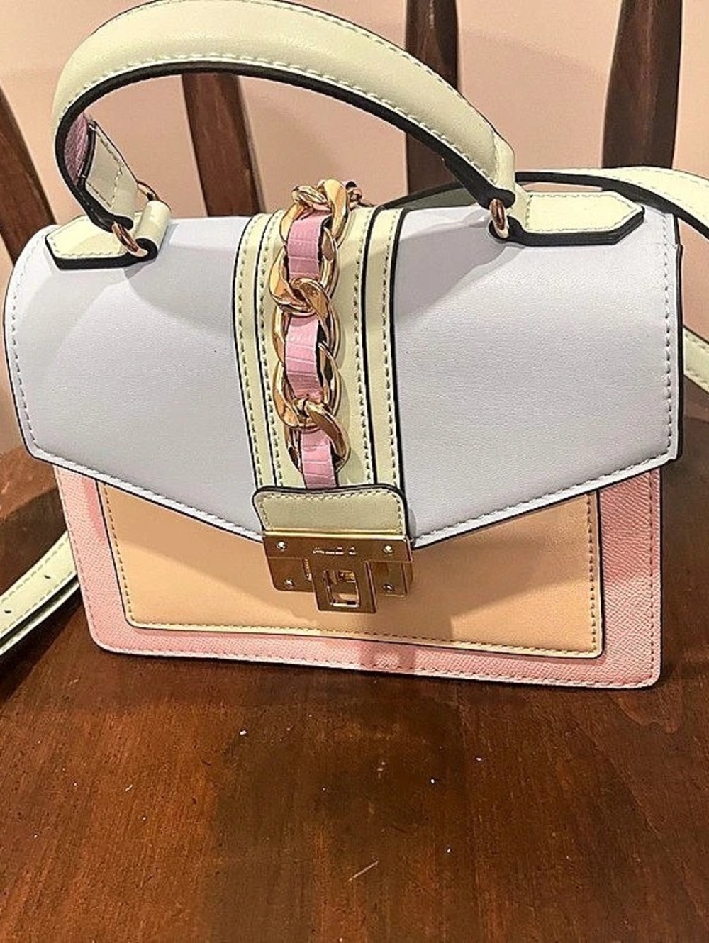 ALDO multicolor never used but has some minor wear and tear on the hardware